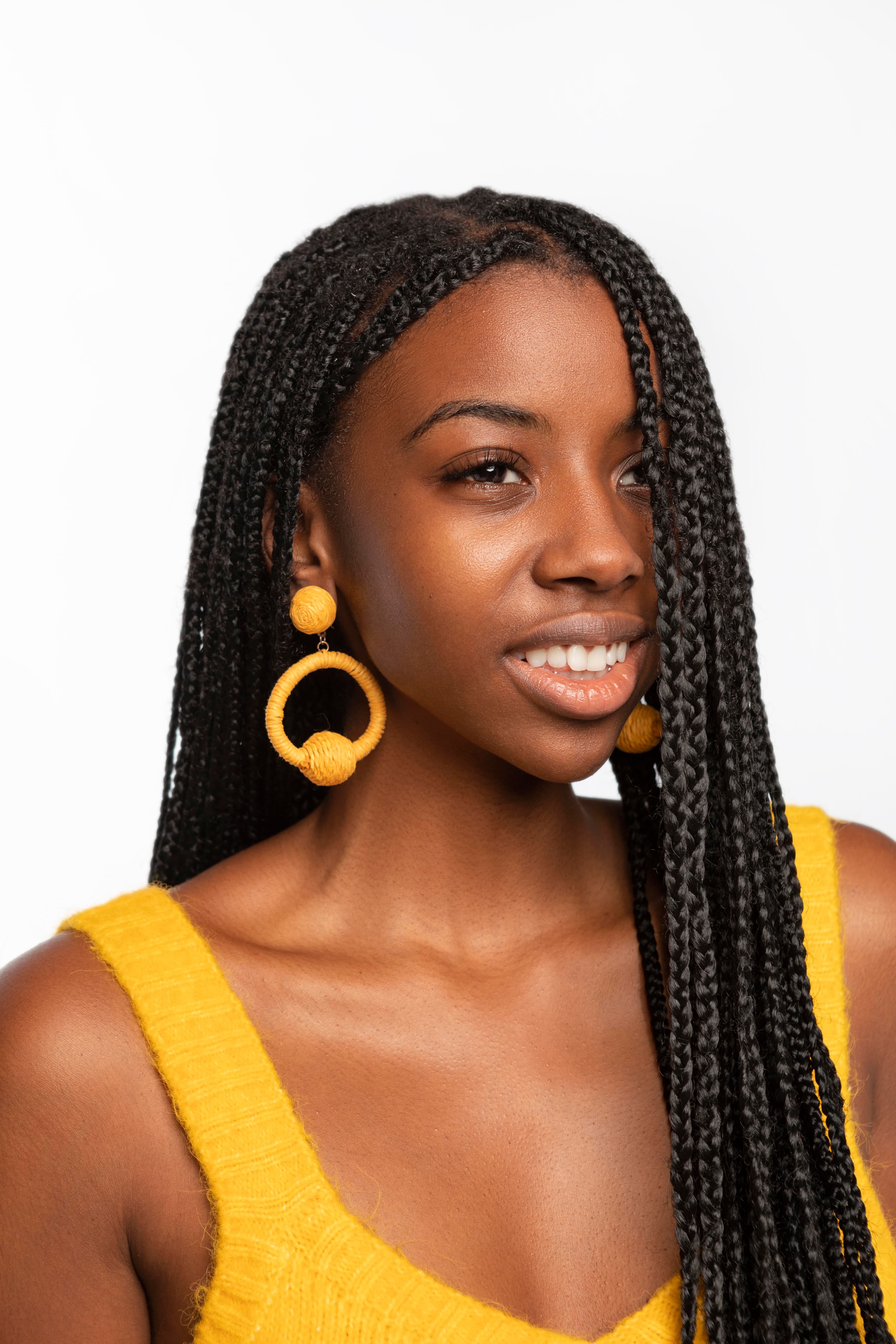 Client portrait with braided protective style